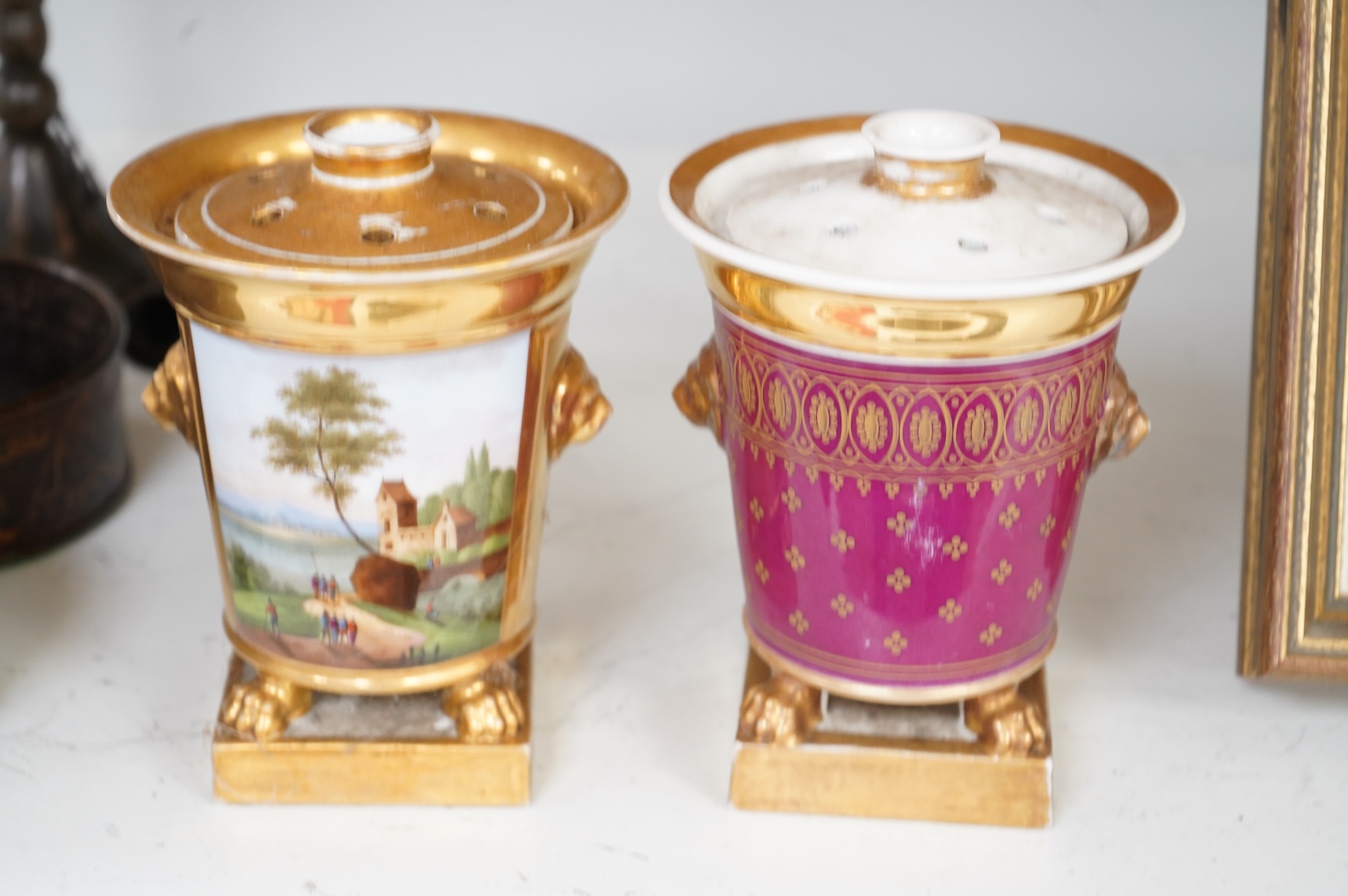 Two early 19th century Paris porcelain pastel burners and covers, decorated with continental landscapes, 15cm high